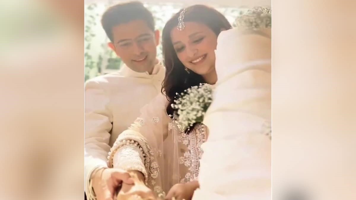 Parineeti Chopra And Raghav Chadha Are Happiest While Cutting The Engagement Cake.